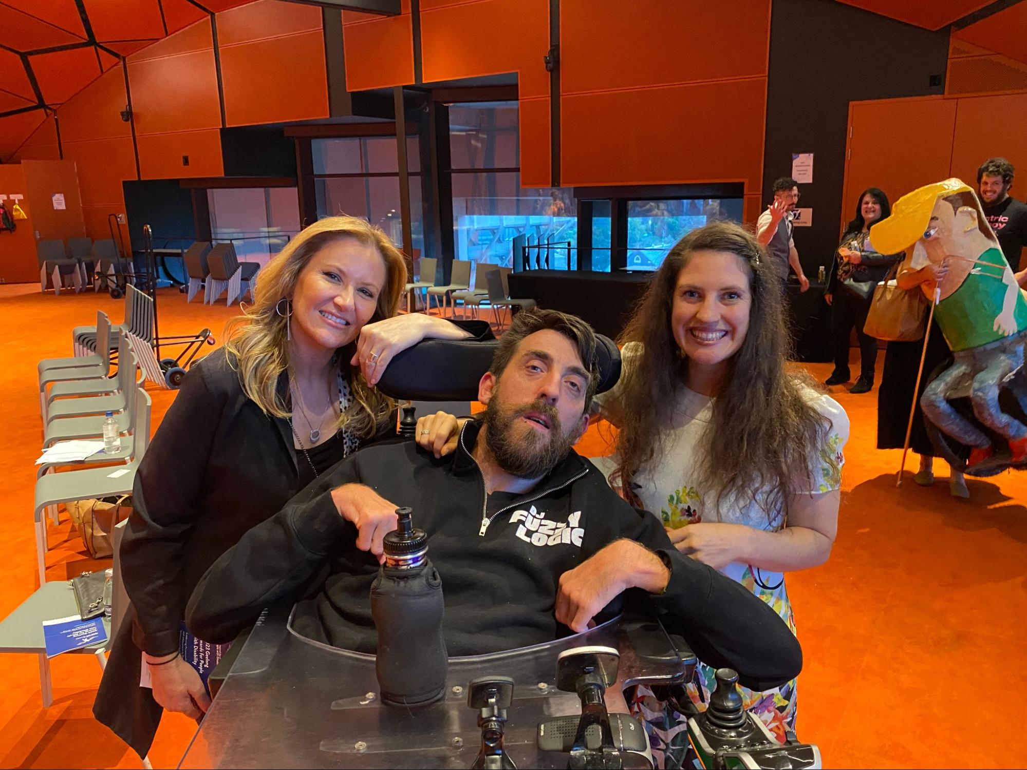 Pictured: Anna and Rachael from RIAC striking a pose with DJ Fuzzy Logic (Ryan Schmidtke).